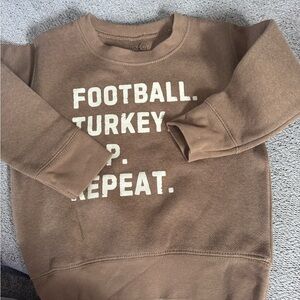 Brown Sweatshirt with White Text